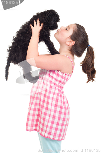 Image of Girl kissing dog