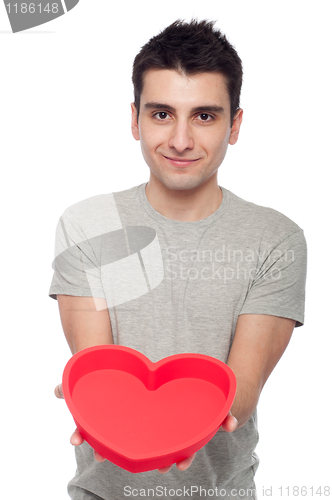 Image of Casual man holding heart