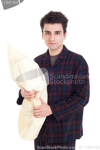 Image of Man in pajamas holding pillow