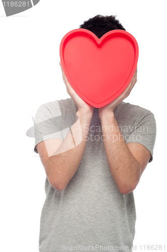 Image of Casual man holding heart