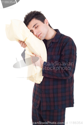 Image of Man in pajamas holding pillow