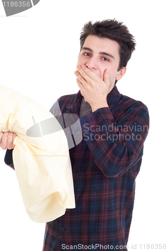 Image of Man in pajamas holding pillow