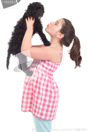 Image of Girl kissing dog