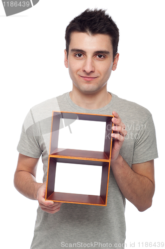 Image of Man holding frame