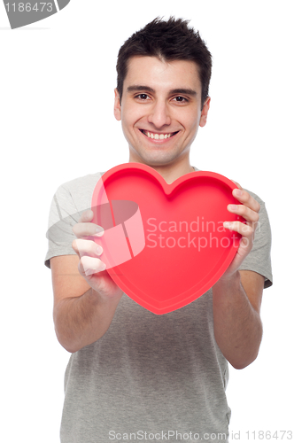 Image of Casual man holding heart