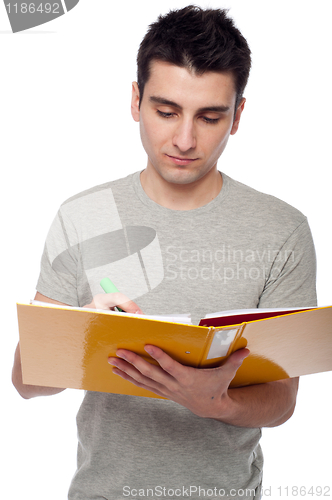 Image of Man studying with dossier