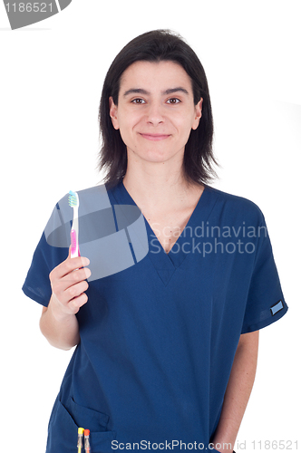 Image of Dentist holding toothbrush