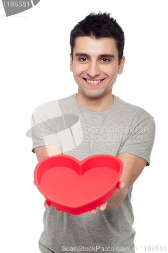 Image of Casual man holding heart