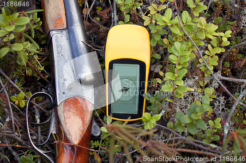 Image of Hunting rifle and a navigator