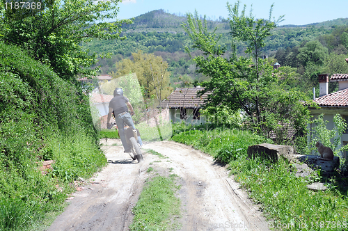 Image of Riding Motorbike Down Country Road