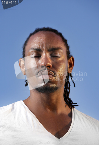 Image of Young athletic man taking a break