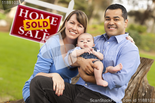 Image of Mixed Race Couple, Baby, Sold Real Estate Sign