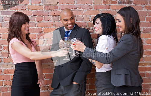 Image of Young people drinking wine and having fun