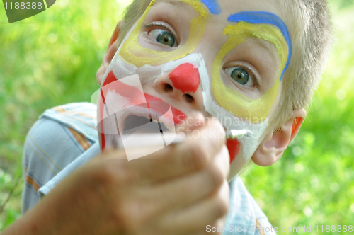 Image of child face mask party painting