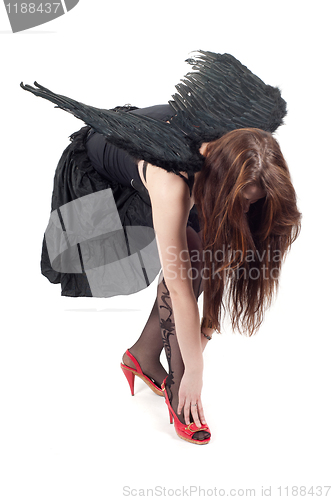 Image of Beautiful brunette woman with black wings