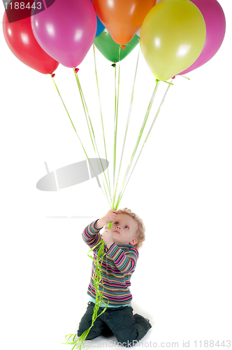 Image of Little cute girl with multicolored air balloons