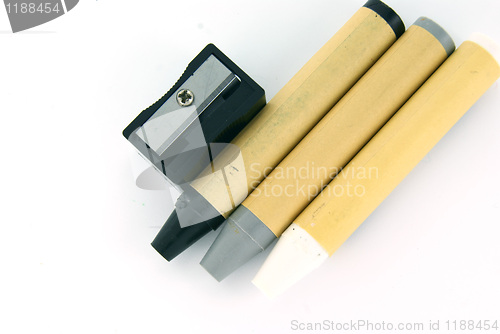 Image of Black, grey and white crayons on white