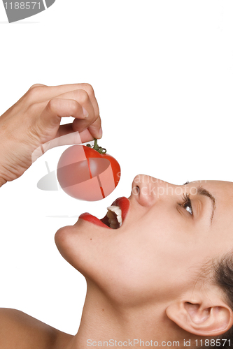Image of Young Woman Eating Tomatoes