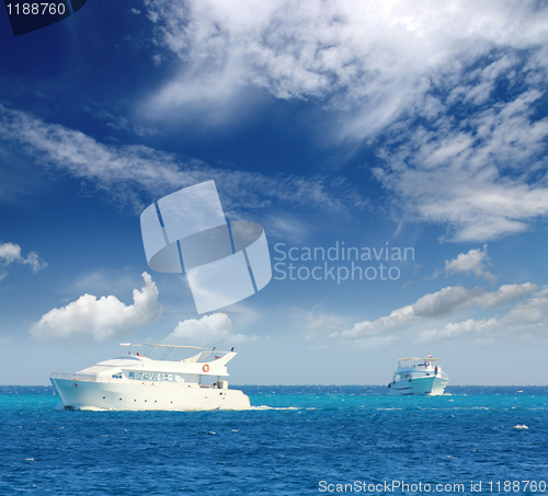 Image of white boats sailing on turquoise sea