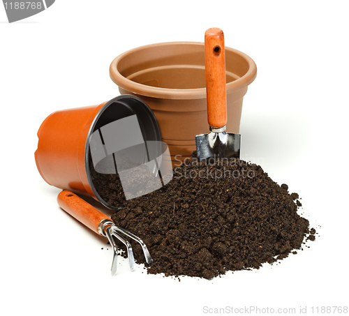 Image of Pots, gardening tools and dirt