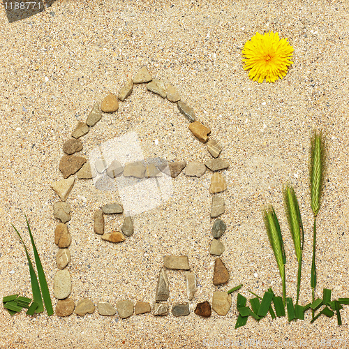 Image of Stone house illustration in sand