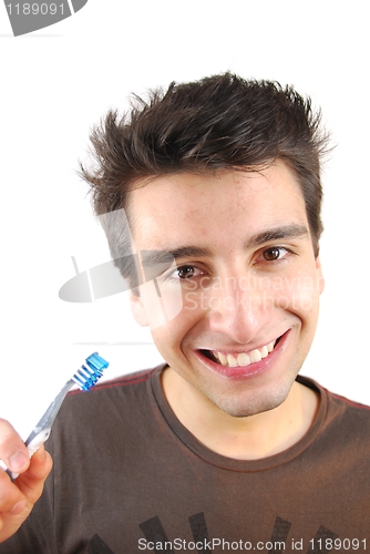 Image of Cute guy washing his teeth