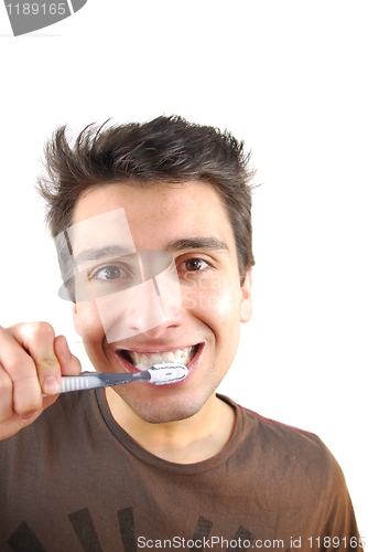Image of Cute guy washing his teeth