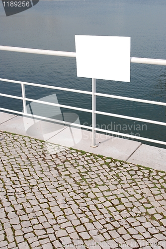 Image of Empty sign near water