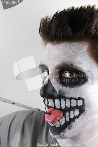 Image of Murderer skeleton guy with a bloody knife