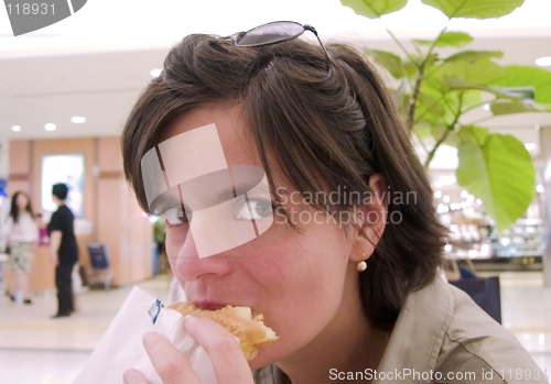 Image of Girl eating snack