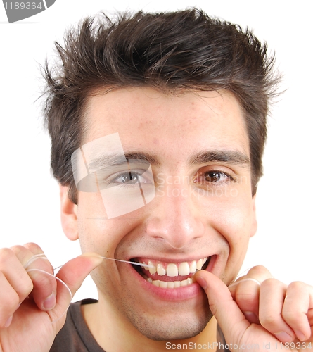Image of Man flossing his teeth