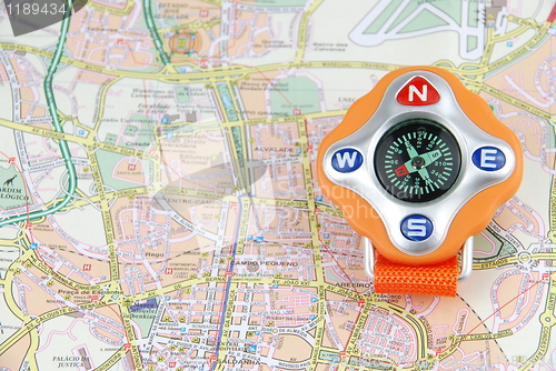 Image of Travel concept with a compass on a map