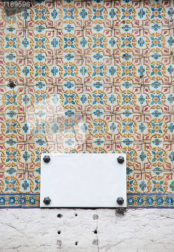 Image of Portuguese azulejos and a empty sign