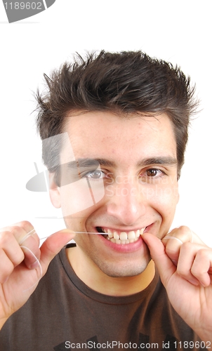 Image of Man flossing his teeth