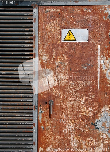 Image of High voltage sign on a rusty door