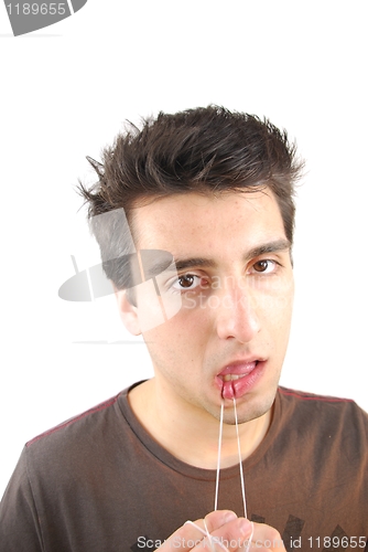 Image of Man flossing his teeth (don't want expression)