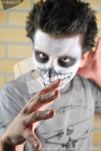 Image of Evil look and hand (Carnival portrait)