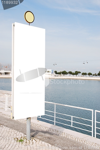 Image of Empty signpost near water