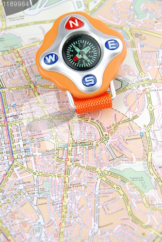 Image of Travel concept with a compass on a map