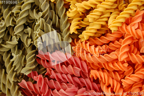 Image of colored twirls pasta background