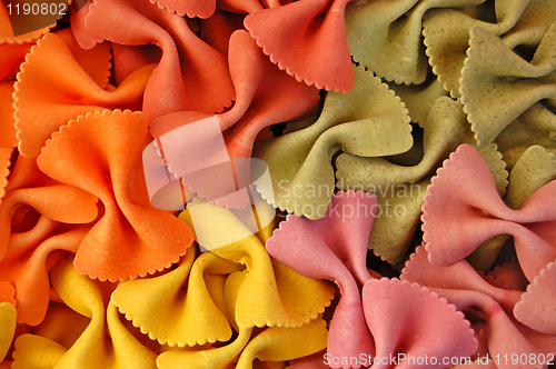 Image of colored farfalle pasta background