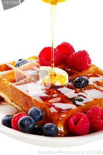 Image of Syrup Pouring Over Waffles