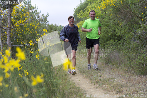 Image of Couple running