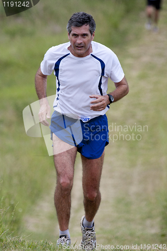 Image of Man running at Pavie