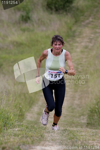 Image of Mature woman running