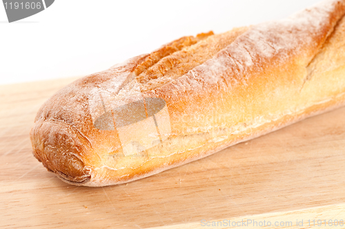 Image of baguette on the wooden board 