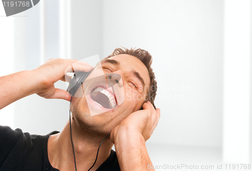 Image of Man listening the music