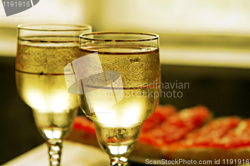 Image of champagne glasses and red caviar