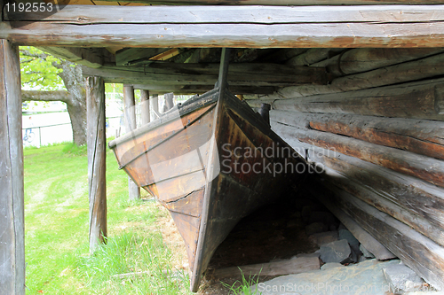 Image of Old boat house and a boat