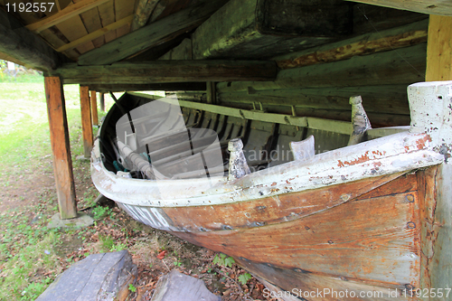 Image of Old boat house and a boat